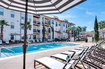 Swimming pool deck with chaise lounge  